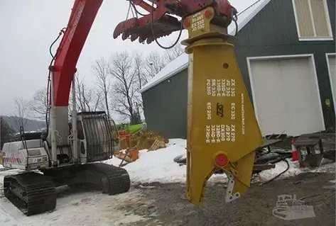 Excavator with a shear attachment